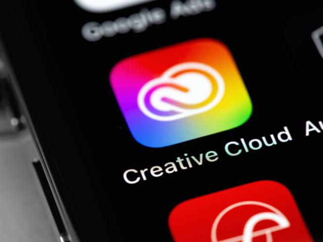 Adobe Creative Cloud mobile app icon on screen smartphone, iPhon